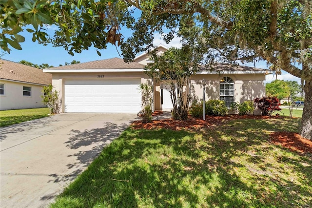 2662 6th Ct E, Ellenton, FL 34222 - ranch-style house with an attached garage, driveway, a front yard, and stucco siding