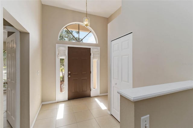 2662 6th Ct E, Ellenton, FL 34222 - entrance foyer with baseboards, light tile patterned floors, and a chandelier