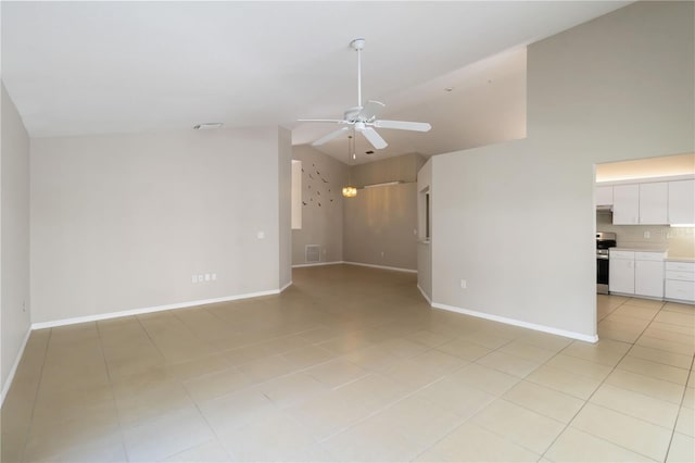 2662 6th Ct E, Ellenton, FL 34222 - unfurnished living room with a ceiling fan, light tile patterned floors, baseboards, and high vaulted ceiling