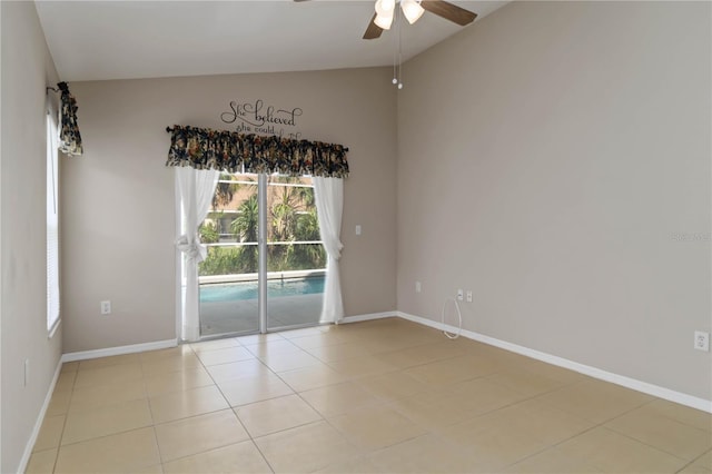 2662 6th Ct E, Ellenton, FL 34222 - empty room with ceiling fan, healthy amount of natural light, light tile patterned floors, baseboards, and high vaulted ceiling