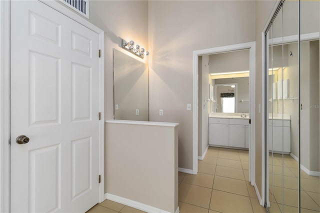 2662 6th Ct E, Ellenton, FL 34222 - bathroom with vanity, tile patterned flooring, and baseboards