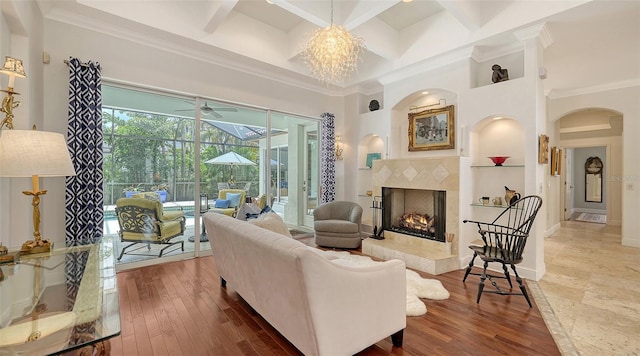 1864 Goldenrod St, Sarasota, FL 34239 - living room with a sunroom, arched walkways, built in features, a towering ceiling, and ceiling fan
