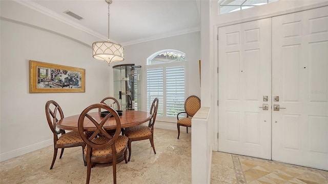 1864 Goldenrod St, Sarasota, FL 34239 - dining space featuring crown molding and baseboards