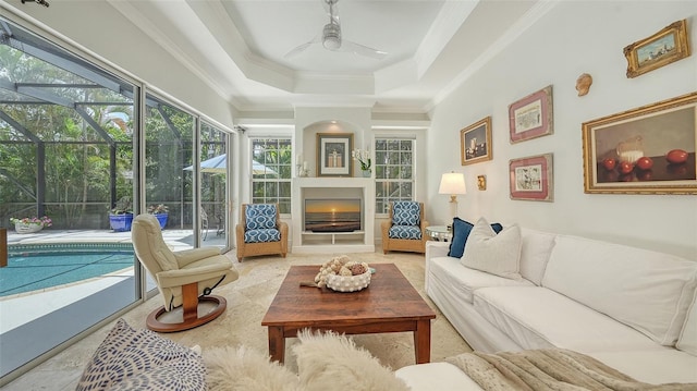 1864 Goldenrod St, Sarasota, FL 34239 - living area with a sunroom, a ceiling fan, a tray ceiling, and crown molding