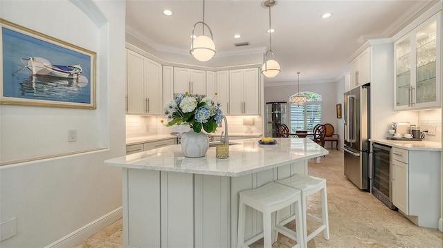 1864 Goldenrod St, Sarasota, FL 34239 - kitchen featuring beverage cooler, high end fridge, decorative backsplash, ornamental molding, and white cabinets