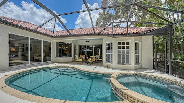 1864 Goldenrod St, Sarasota, FL 34239 - view of swimming pool with a patio area, ceiling fan, glass enclosure, and a pool with connected hot tub