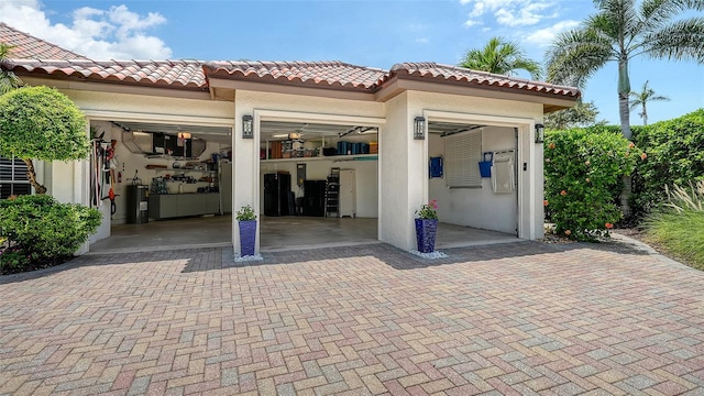 1864 Goldenrod St, Sarasota, FL 34239 - view of patio / terrace with an attached garage and electric water heater