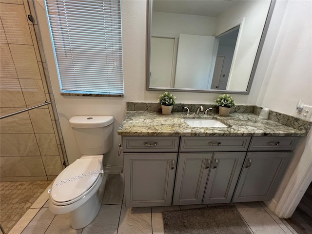 4441 Groveland Ave, Sarasota, FL 34231 - bathroom featuring toilet, vanity, a tile shower, and tile patterned floors