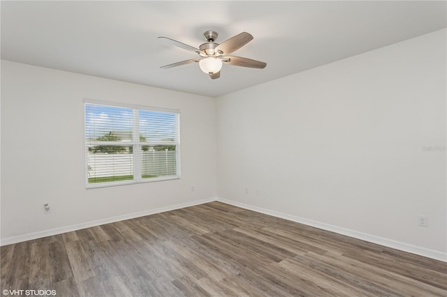 4005 Willow Branch Pl, Palmetto, FL 34221 - spare room featuring wood finished floors, ceiling fan, and baseboards