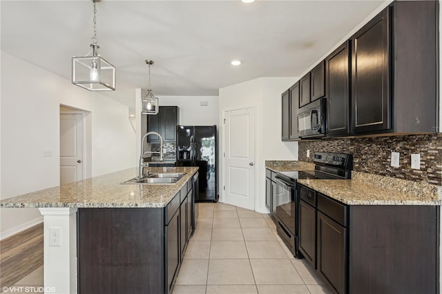 4005 Willow Branch Pl, Palmetto, FL 34221 - kitchen with black appliances, a sink, backsplash, and dark brown cabinetry