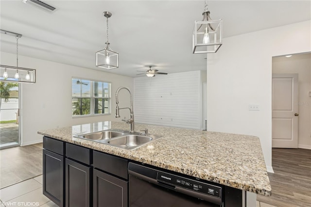 4005 Willow Branch Pl, Palmetto, FL 34221 - kitchen featuring black dishwasher, a sink, an island with sink, a ceiling fan, and hanging light fixtures