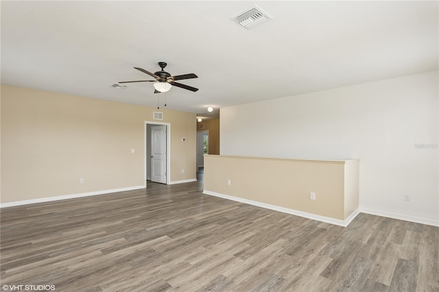 4005 Willow Branch Pl, Palmetto, FL 34221 - unfurnished room featuring wood finished floors, ceiling fan, and baseboards