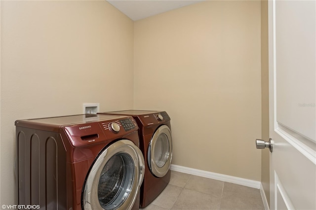 4005 Willow Branch Pl, Palmetto, FL 34221 - laundry area with separate washer and dryer, light tile patterned flooring, and baseboards