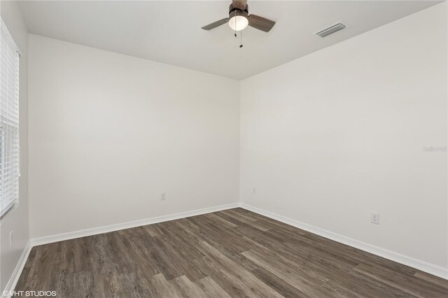 4005 Willow Branch Pl, Palmetto, FL 34221 - empty room with dark wood-style flooring, baseboards, and a ceiling fan