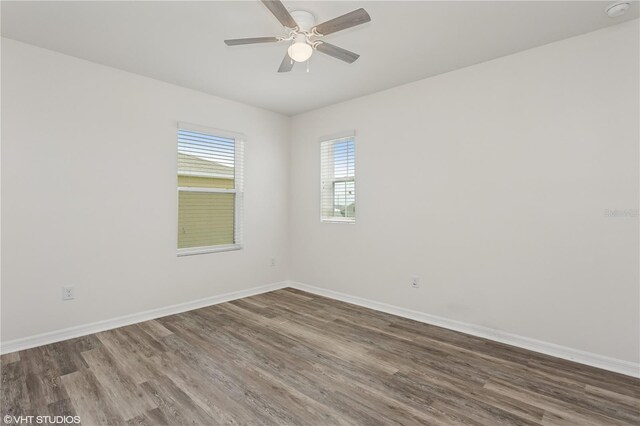 4005 Willow Branch Pl, Palmetto, FL 34221 - unfurnished room with wood finished floors, baseboards, ceiling fan, and a smoke detector