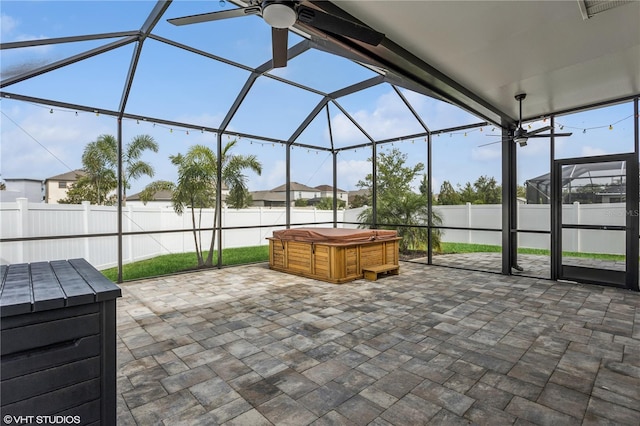 4005 Willow Branch Pl, Palmetto, FL 34221 - fenced backyard featuring a hot tub, a patio area, a lanai, and a ceiling fan
