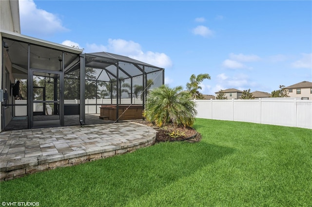 4005 Willow Branch Pl, Palmetto, FL 34221 - view of yard with a hot tub, a patio, and glass enclosure