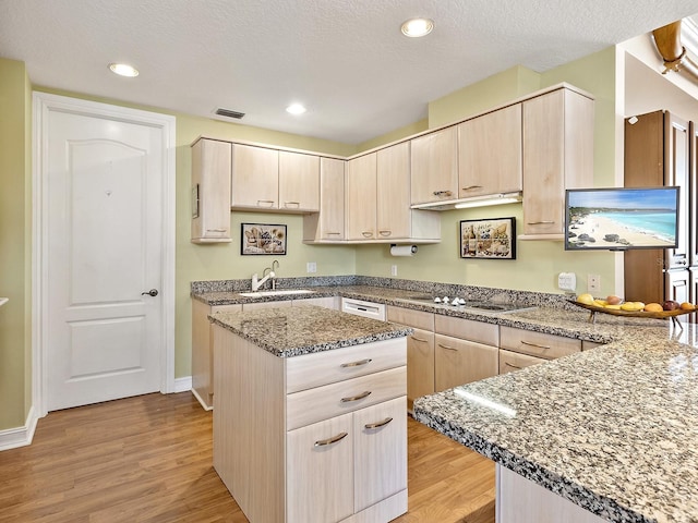1233 N Gulfstream Ave Unit 401, Sarasota, FL 34236 - kitchen featuring a sink, light wood-style flooring, light brown cabinets, and recessed lighting