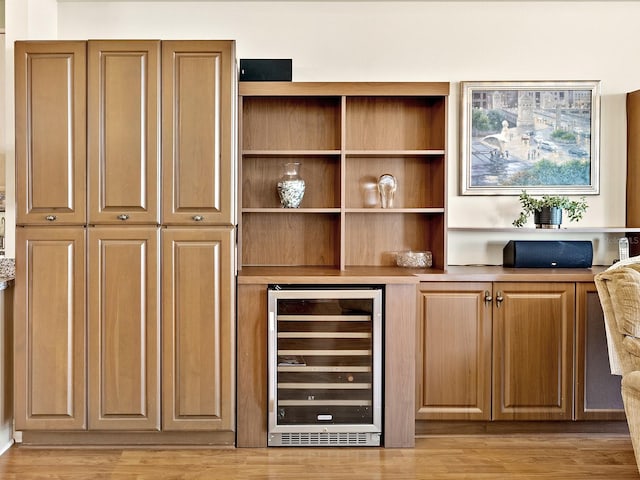 1233 N Gulfstream Ave Unit 401, Sarasota, FL 34236 - bar area with beverage cooler and light wood finished floors