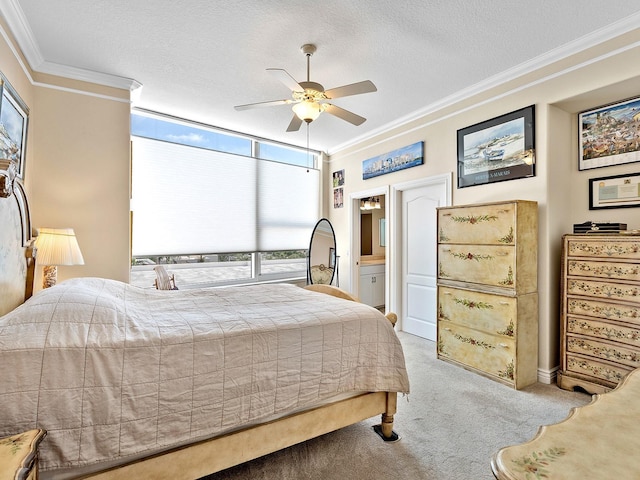 1233 N Gulfstream Ave Unit 401, Sarasota, FL 34236 - carpeted bedroom featuring crown molding, a textured ceiling, a ceiling fan, and connected bathroom