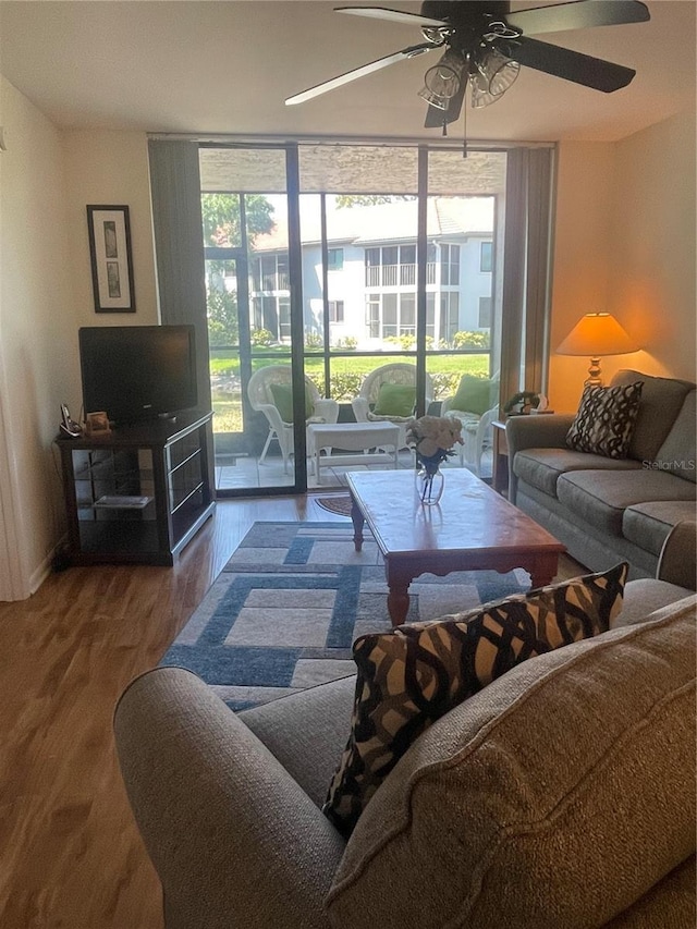 4520 47th Ave W Unit 103, Bradenton, FL 34210 - living room featuring expansive windows, ceiling fan, and wood finished floors