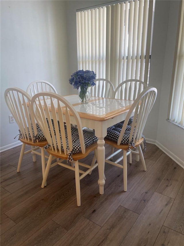 4520 47th Ave W Unit 103, Bradenton, FL 34210 - dining space with hardwood / wood-style flooring, baseboards, and healthy amount of natural light