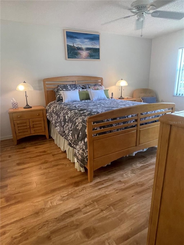 4520 47th Ave W Unit 103, Bradenton, FL 34210 - bedroom featuring wood finished floors, ceiling fan, and a textured ceiling