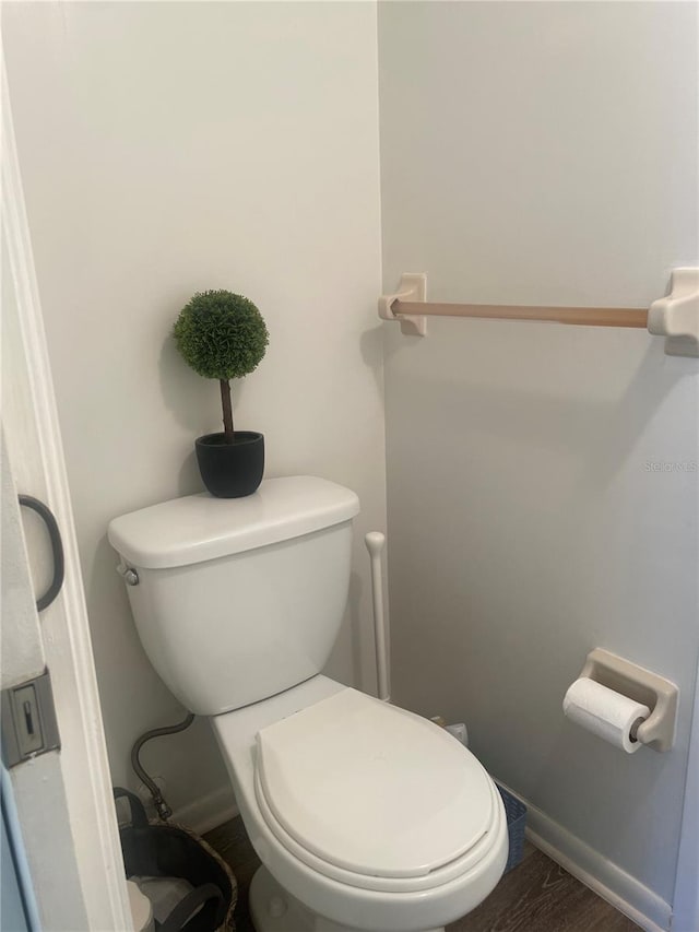 4520 47th Ave W Unit 103, Bradenton, FL 34210 - bathroom featuring toilet, wood finished floors, and baseboards