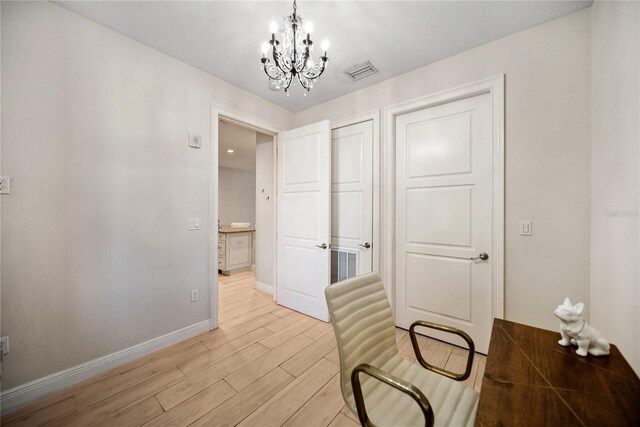 525 N Orange Ave Unit 302, Sarasota, FL 34236 - unfurnished office with a chandelier, light wood finished floors, and baseboards
