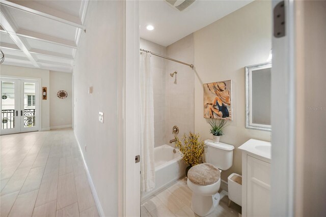 525 N Orange Ave Unit 302, Sarasota, FL 34236 - full bath featuring coffered ceiling, toilet, vanity, shower / bath combo with shower curtain, and baseboards