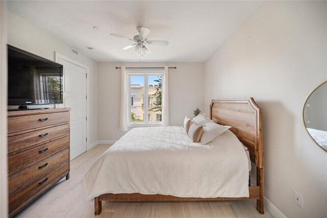 525 N Orange Ave Unit 302, Sarasota, FL 34236 - bedroom with baseboards, light wood finished floors, and a ceiling fan