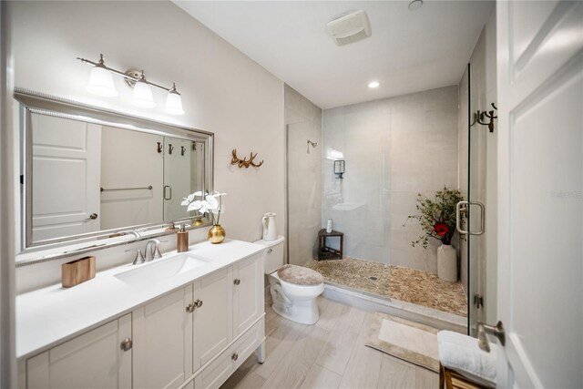 525 N Orange Ave Unit 302, Sarasota, FL 34236 - bathroom with a stall shower, vanity, toilet, and recessed lighting