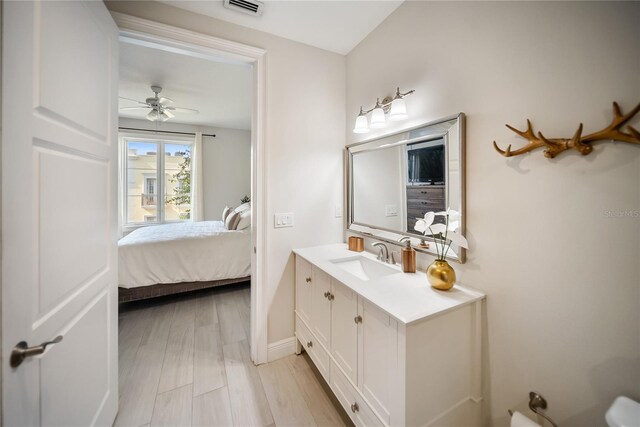 525 N Orange Ave Unit 302, Sarasota, FL 34236 - ensuite bathroom with vanity, ceiling fan, and baseboards