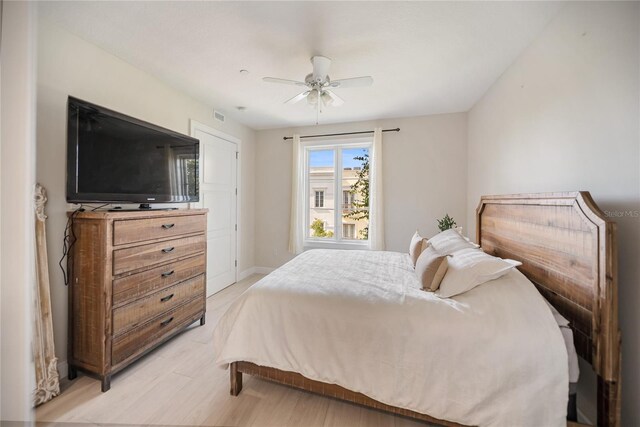 525 N Orange Ave Unit 302, Sarasota, FL 34236 - bedroom featuring light wood-style floors, a ceiling fan, and baseboards