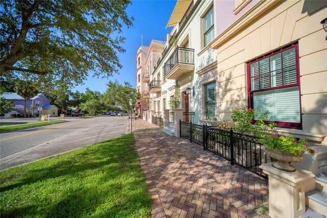 525 N Orange Ave Unit 302, Sarasota, FL 34236 - view of asphalt road featuring sidewalks, a residential view, and curbs