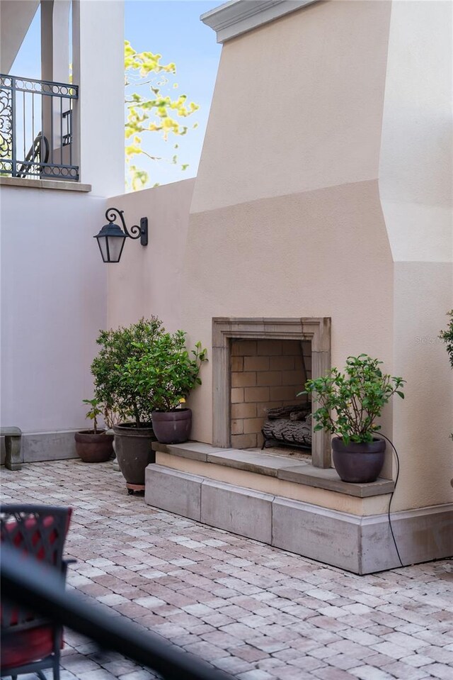 525 N Orange Ave Unit 302, Sarasota, FL 34236 - view of patio featuring a fireplace with raised hearth