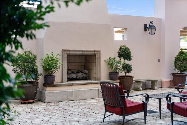 525 N Orange Ave Unit 302, Sarasota, FL 34236 - view of patio with an outdoor fireplace