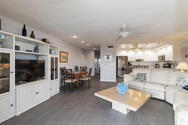 2729 N Beach Rd Unit 212, Englewood, FL 34223 - living area featuring a ceiling fan and recessed lighting