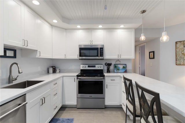 2729 N Beach Rd Unit 212, Englewood, FL 34223 - kitchen with appliances with stainless steel finishes, a sink, recessed lighting, light countertops, and white cabinets