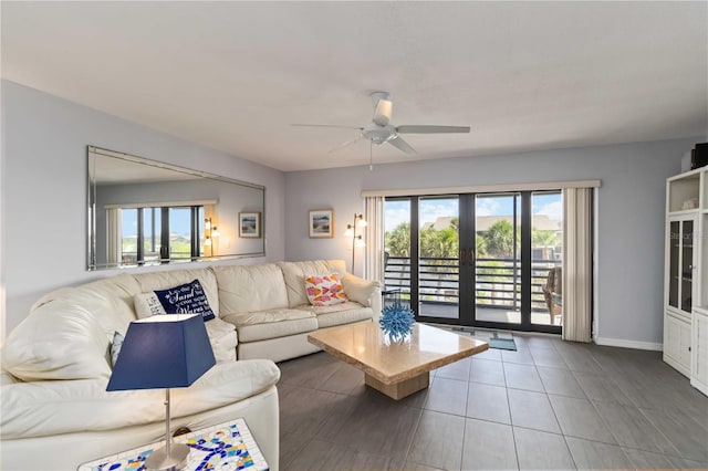 2729 N Beach Rd Unit 212, Englewood, FL 34223 - living area with healthy amount of natural light, ceiling fan, french doors, and baseboards