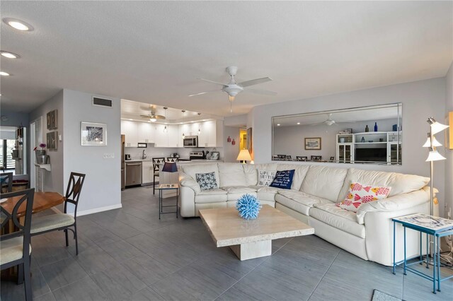 2729 N Beach Rd Unit 212, Englewood, FL 34223 - living area with ceiling fan, recessed lighting, and baseboards