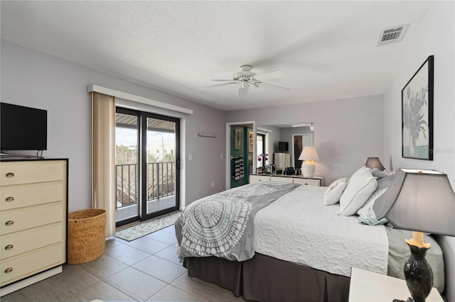 2729 N Beach Rd Unit 212, Englewood, FL 34223 - bedroom with access to exterior, tile patterned floors, and ceiling fan