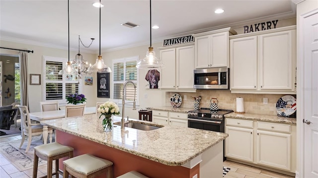 11625 Parrotfish St, Venice, FL 34292 - kitchen with stainless steel appliances, a sink, a chandelier, decorative backsplash, and a kitchen bar