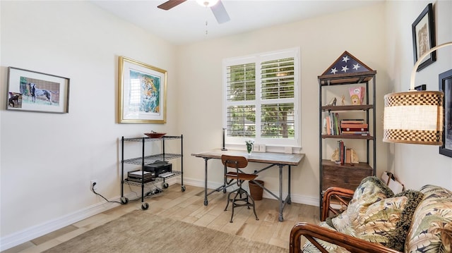 11625 Parrotfish St, Venice, FL 34292 - home office featuring a ceiling fan, wood finished floors, and baseboards