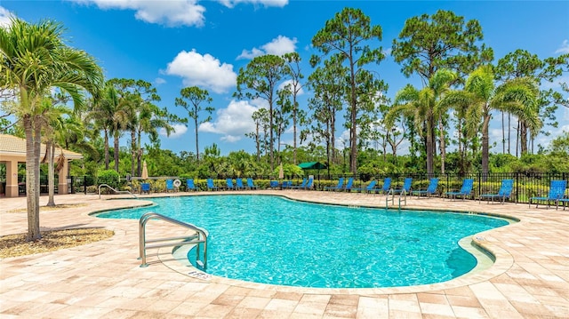 11625 Parrotfish St, Venice, FL 34292 - community pool with a patio and view of scattered trees
