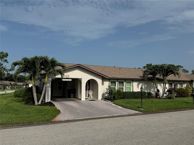 3752 Collins St Unit 508, Sarasota, FL 34232 - ranch-style house featuring driveway, stucco siding, a front lawn, and an attached garage