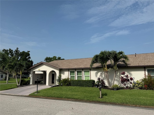 3752 Collins St Unit 508, Sarasota, FL 34232 - ranch-style house featuring concrete driveway, stucco siding, and a front lawn