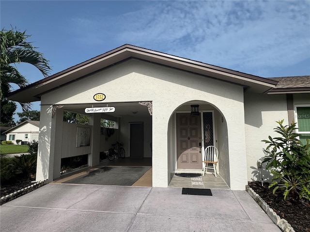 3752 Collins St Unit 508, Sarasota, FL 34232 - doorway to property with stucco siding