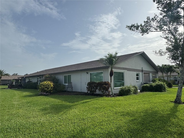 3752 Collins St Unit 508, Sarasota, FL 34232 - rear view of house featuring a yard