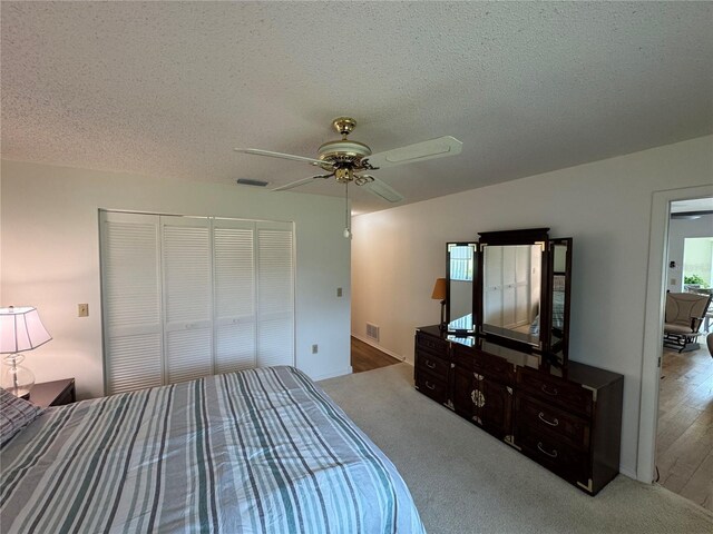 3752 Collins St Unit 508, Sarasota, FL 34232 - unfurnished bedroom featuring a textured ceiling, a closet, a ceiling fan, and carpet floors